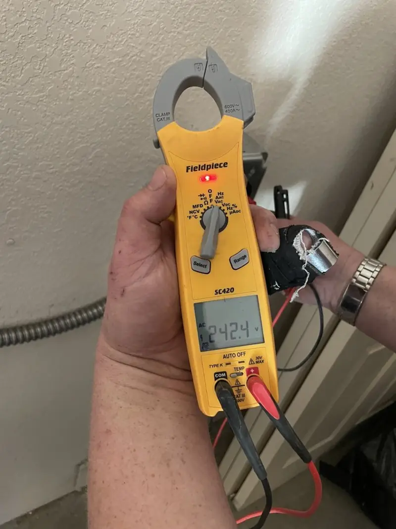 Voltage testing with clamp meter during Outlet Installation in Rocky Mount